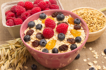Healthy porridge with fruits on canvas