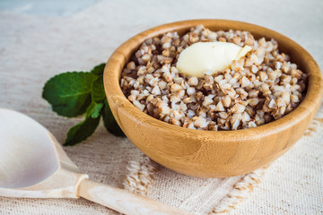 Buckwheat porridge in a wooden bowl