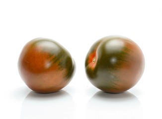 kumato tomatoes isolated on white background