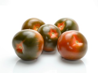 kumato tomatoes isolated on white background