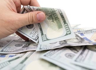 Dollars in hand on a white background