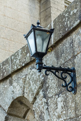Old-fashioned street lamp against the building. Powerscourt. Ireland.