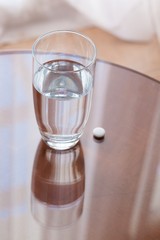 Obraz premium water glass and pill
