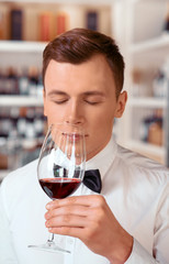 Professional sommelier tasting wine 