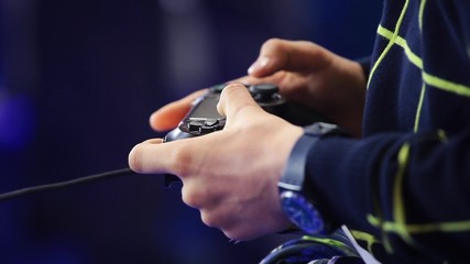 Playing games console close up, man playing video game with joystick 