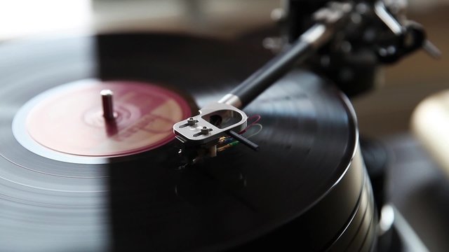 Record player playing vinyl, retro vinyl turntable stylus close up