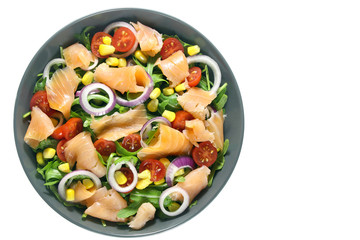 Salad with arugula, tomatoes, corn, smoked salmon and red onion