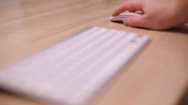 Work with a white computer mouse.