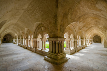 Beautiful view of the cloister courtyard of famous Cistercian Abbey of Fontenay, a UNESCO World Heritage Site since 1981, in the commune of Marmagne, Burgundy, France
