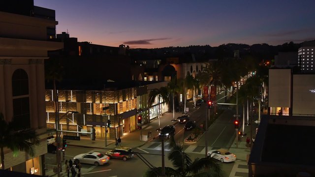 BEVERLY HILLS, CA - Circa February, 2016: A high-angle night establishing shot view of an intersection on Rodeo Drive.  	