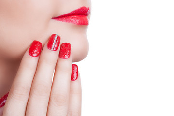Fototapeta premium Young woman with fashion red nails and lips