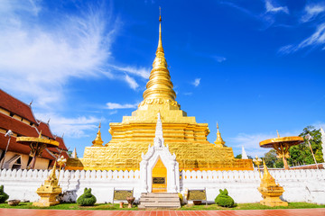 Fototapeta premium Golden Pagoda in Nan Province, Thailand. Phra That Chae Haeng Te
