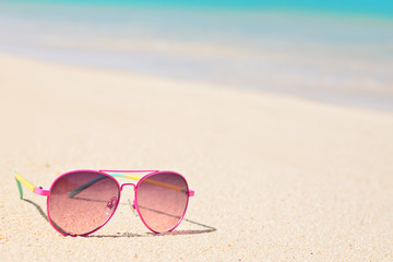 Fototapeta na wymiar Pink Sunglasses on the beach