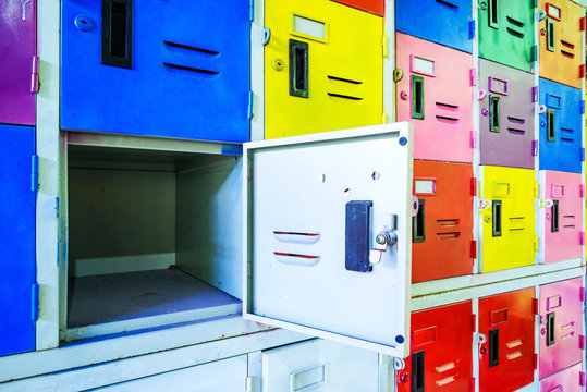 Row Of Old Colors Metal Lockers One Is Open.