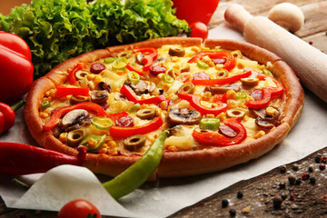 Delicious sliced pizza with vegetables, close-up