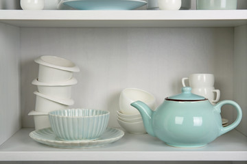 Dishes in cupboard in the kitchen