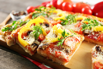 Pieces of delicious pizza on the table, close-up