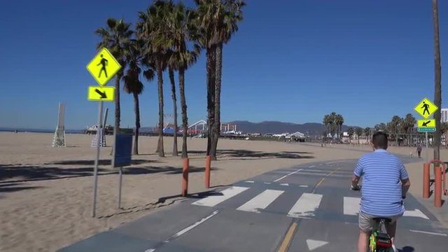 SANTA MONICA, CA - Circa February, 2016: A bicycle rider's POV of traveling near the Santa Monica Pier. Part 1 of 8. 
