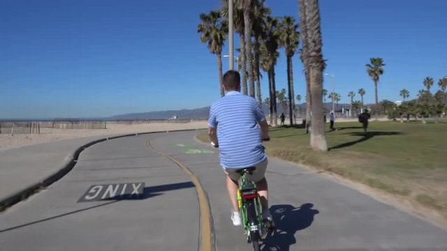 SANTA MONICA, CA - Circa February, 2016: A bicycle rider's POV of traveling on Santa Monica's biking path. Part 2 of 5.  	