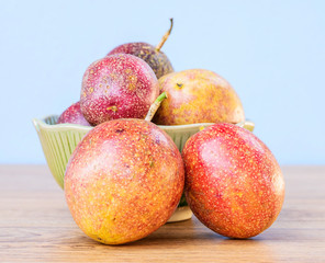 Fresh passion fruit isolated on wooden background