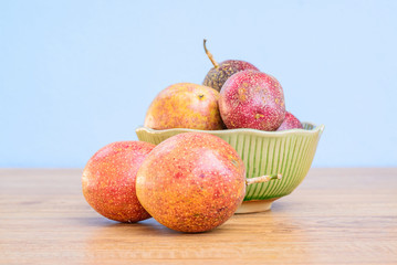 Fresh passion fruit isolated on wooden background