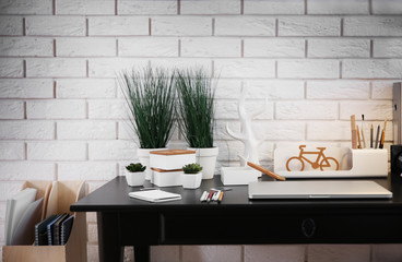 Workplace with laptop on table at home