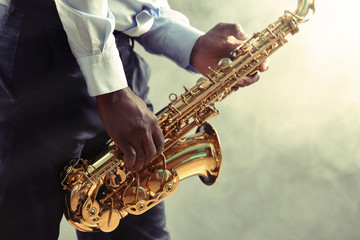 Obraz premium African American jazz musician playing the saxophone, closeup