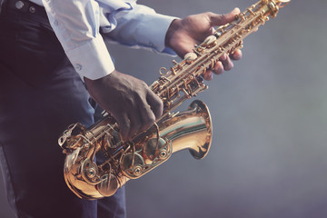 African American jazz musician playing the saxophone, closeup