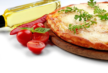 Pizza full of cheese on wooden board with vegetables isolated on white background, close up
