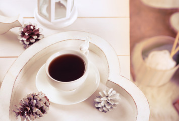 Cup of hot drink in living room. Comfortable winter weekend or holidays at home