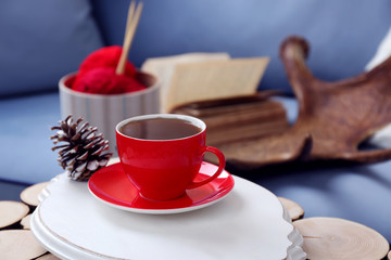 Cup of hot drink in living room. Comfortable winter weekend or holidays at home