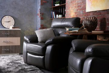 Modern living room interior with leather armchairs