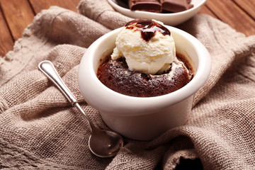 Served table of chocolate lava cake with ice-cream