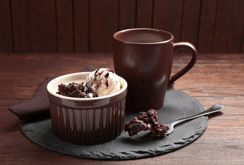 Served table of chocolate lava cake with ice-cream and milk