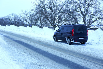 Car standing on roadside winter road, outdoor