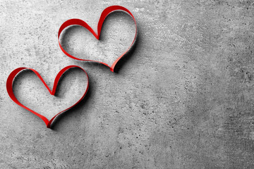 Obraz premium Valentine's Day heart made of ribbon on dark background