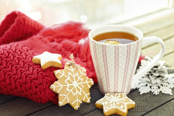 Beautiful winter composition with cup of hot drink, on wooden table