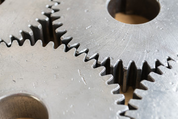 close up gears set for unity meaning on wood background