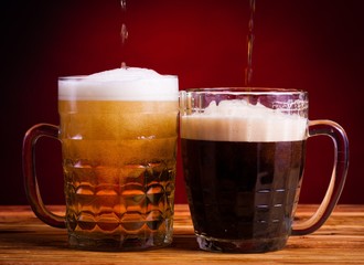 Drink. two glasses beer red background!