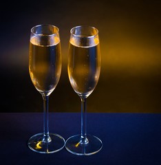 Drink. two glasses champagne yellow background