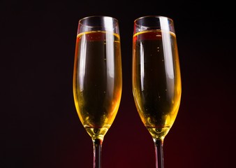 Drink. two glasses champagne yellow background