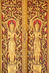 Fototapeta na wymiar Gold Angels stripes Thai arts on door church