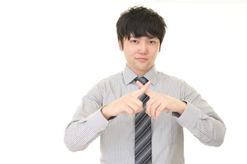 禁止の意思表示をするビジネスマン