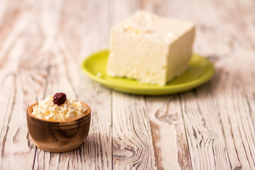 cottage cheese with fruit on a wooden table
