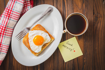 fried egg with toast on a plate