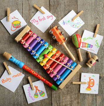 Musical instruments collection on old wooden table background. Top view