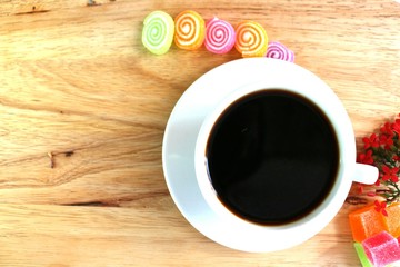 coffee break with snacks wood background