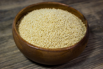 Couscous for a healthy diet on wooden background