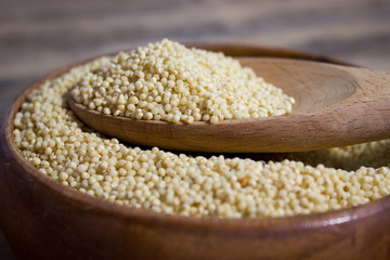 Couscous for a healthy diet on wooden background
