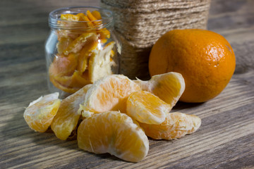 Mandarin slices on wooden background